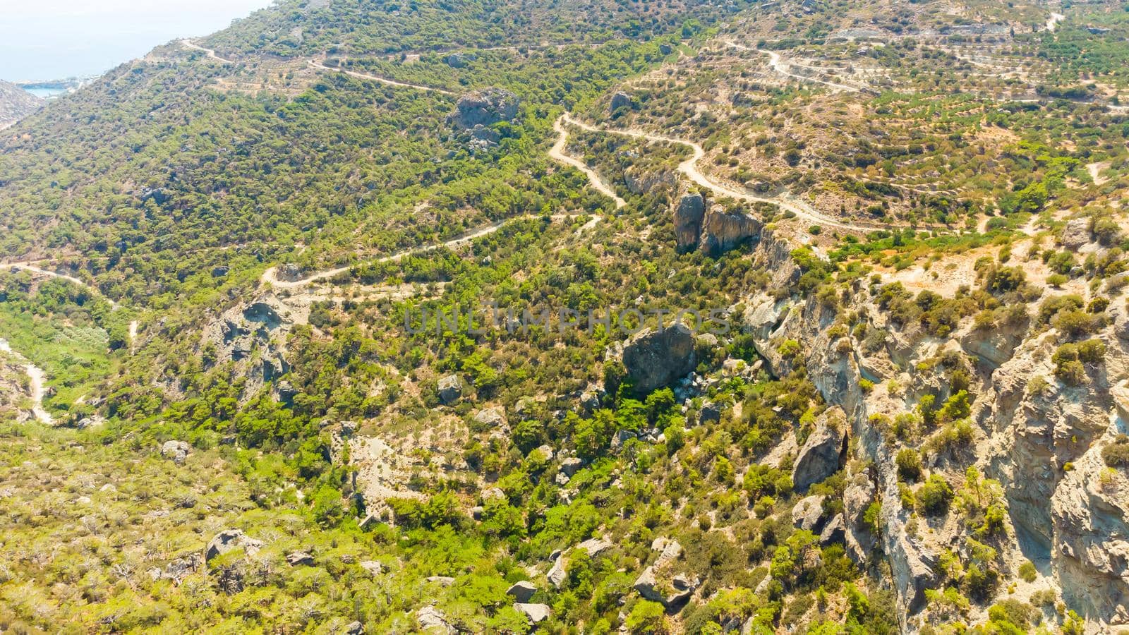 Landscape of high hills in Crete on the background of the sky.