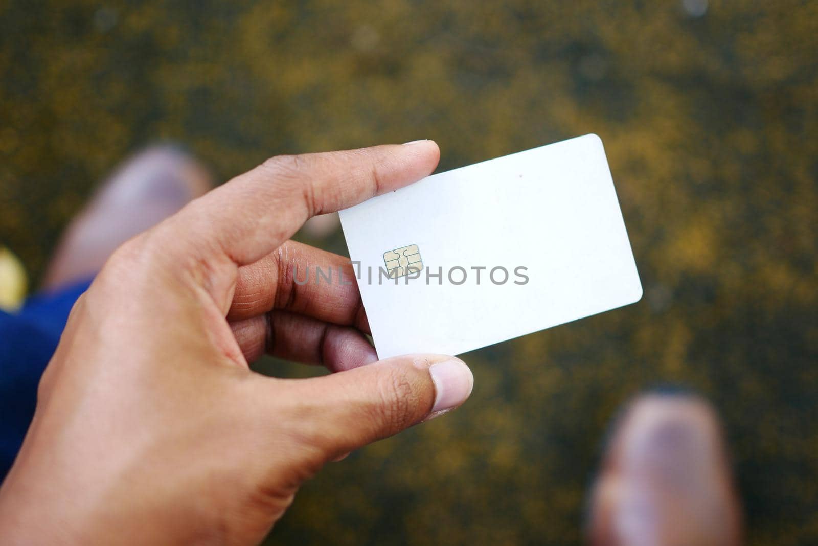 close up of person hand holding credit card.