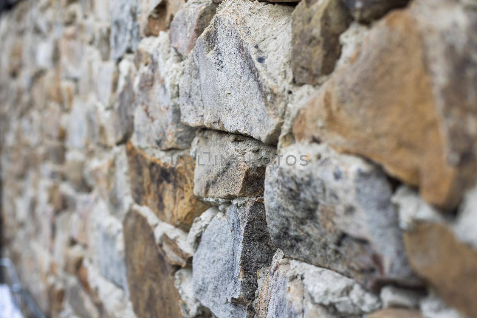 Texture of a stone wall. Old castle stone wall texture background. Stone wall as a background or texture. Part of a stone wall, for background or texture