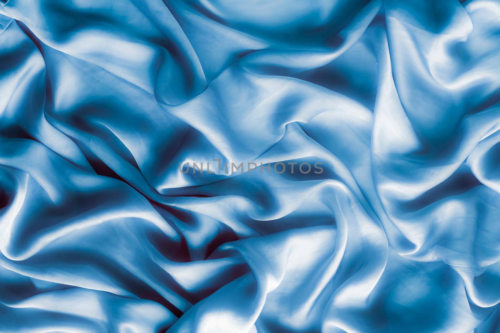 Blue soft silk waves, flatlay - elegant fabric textures, abstract backgrounds and modern pastel colours concept. Feel the touch of luxury