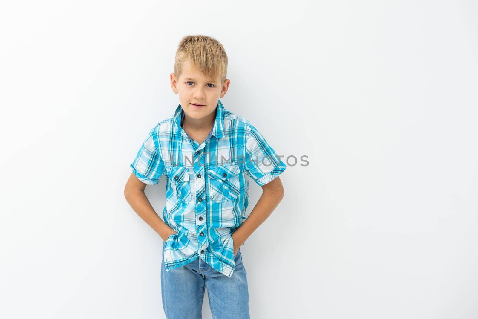 Portrait of happy little boy over white background by Andelov13