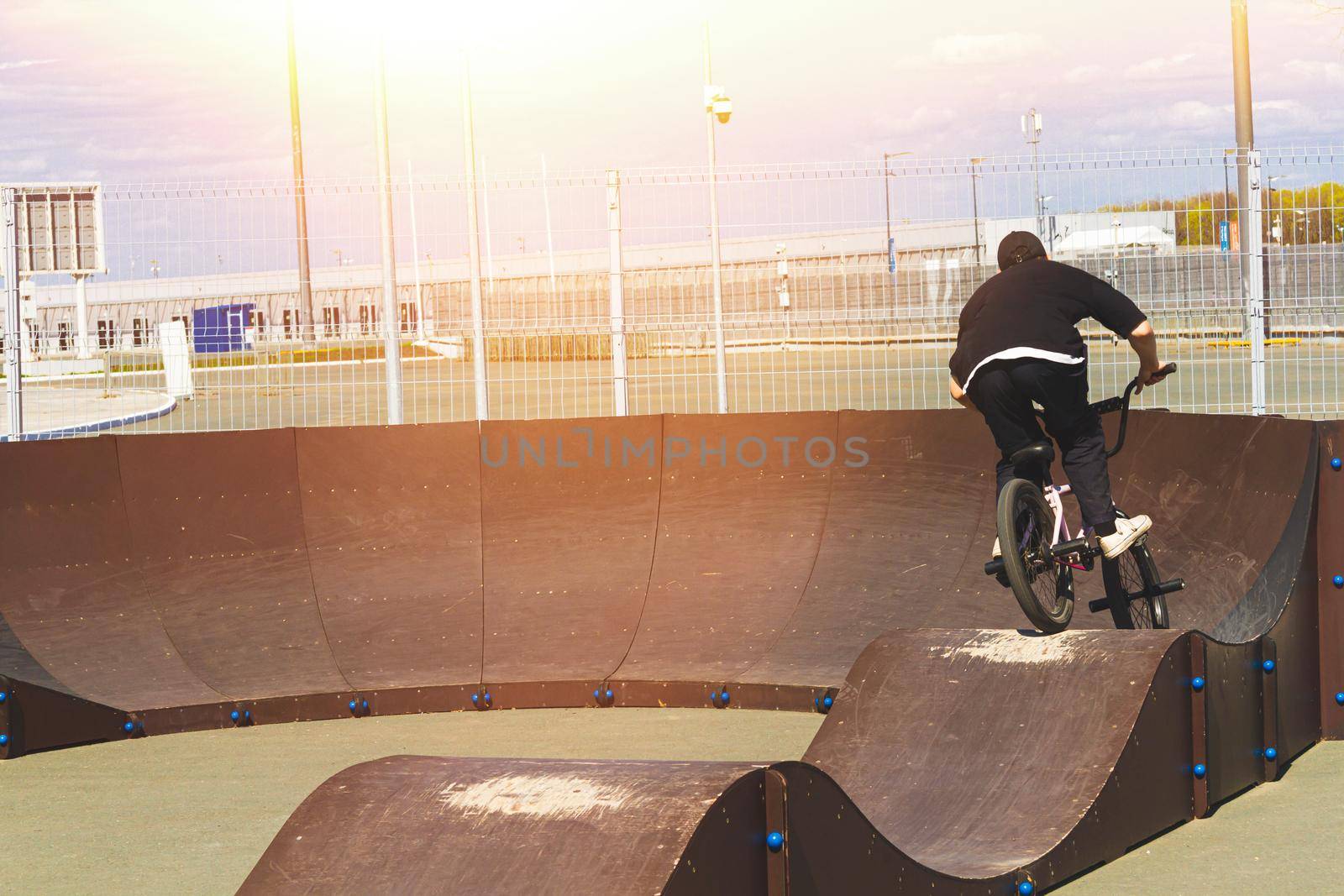 Cycling on the track. The cyclist rides on the hills of the track. Trick bike. Performing tricks on the track.