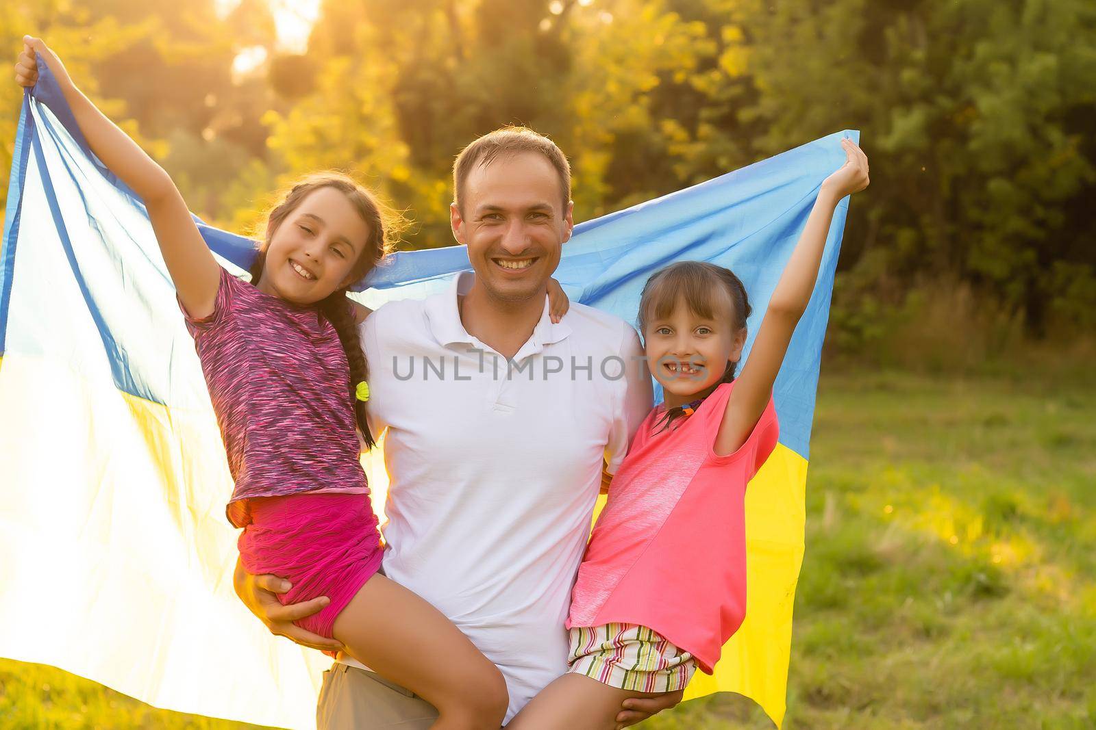family with the flag of ukraine. Happy Independence Day of Ukraine. National Flag Day. Love for the homeland and symbols. Copy space