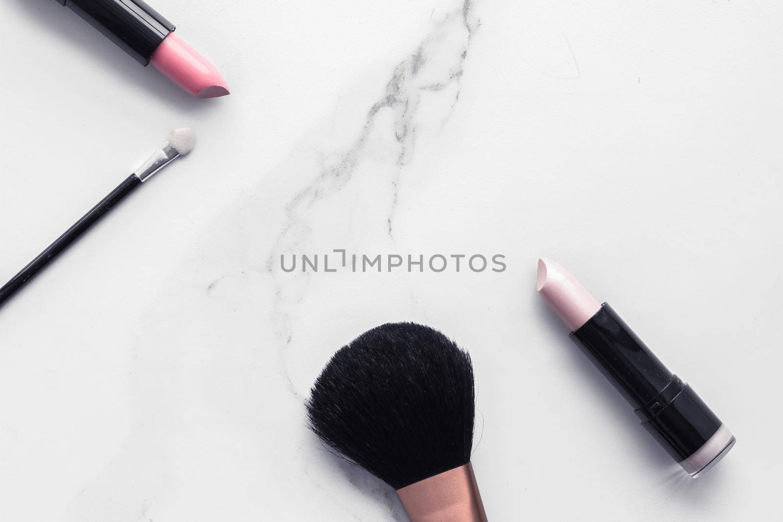 Make-up and cosmetics flatlay on marble by Anneleven