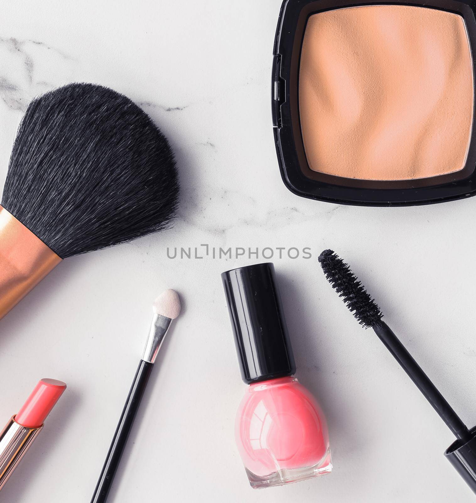 Make-up and cosmetics flatlay on marble by Anneleven