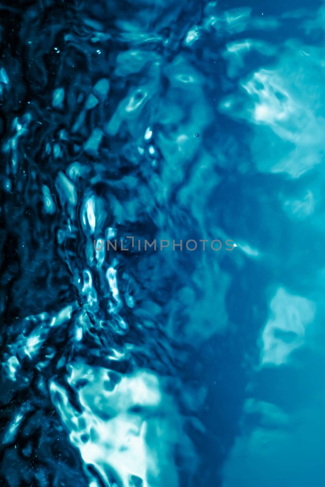 Abstract blue liquid surface as background - futuristic design and science concept. Deep blue waters