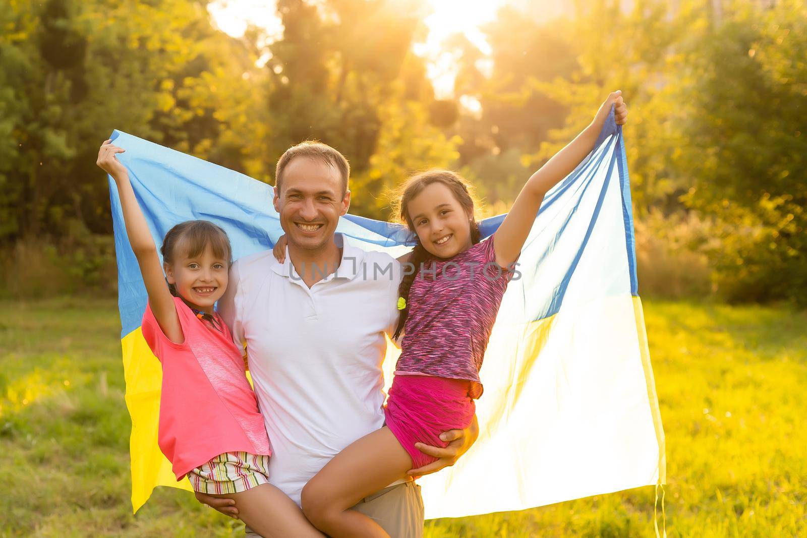 happy family with flag of ukraine in field. lifestyle.