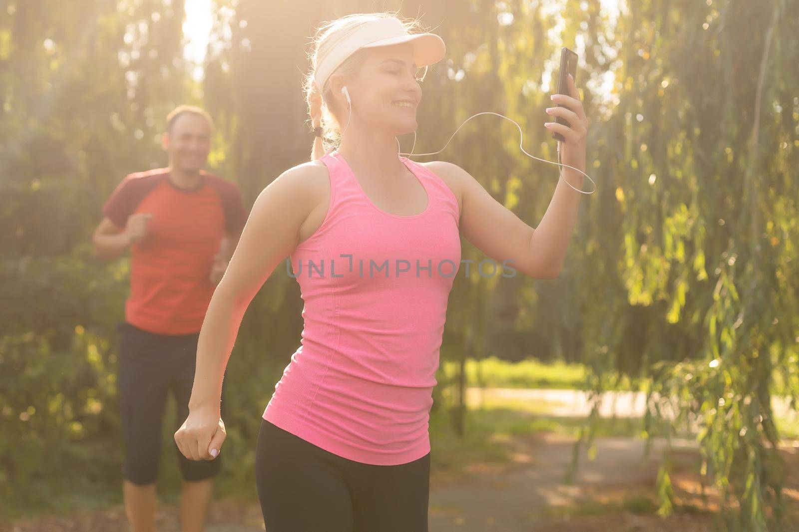 Jogging woman running in park.