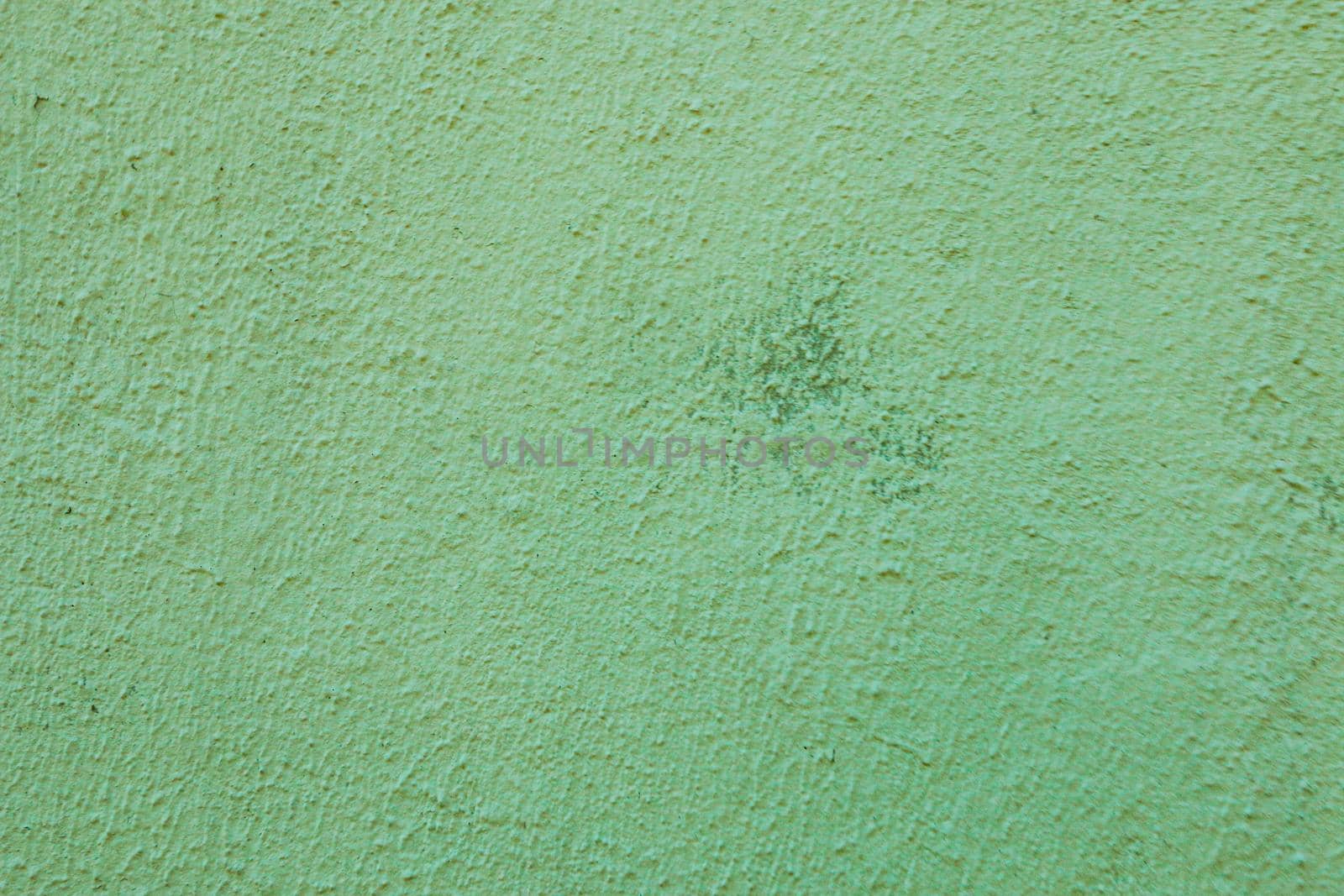 Decorative plaster texture. Beautiful green stucco Background.