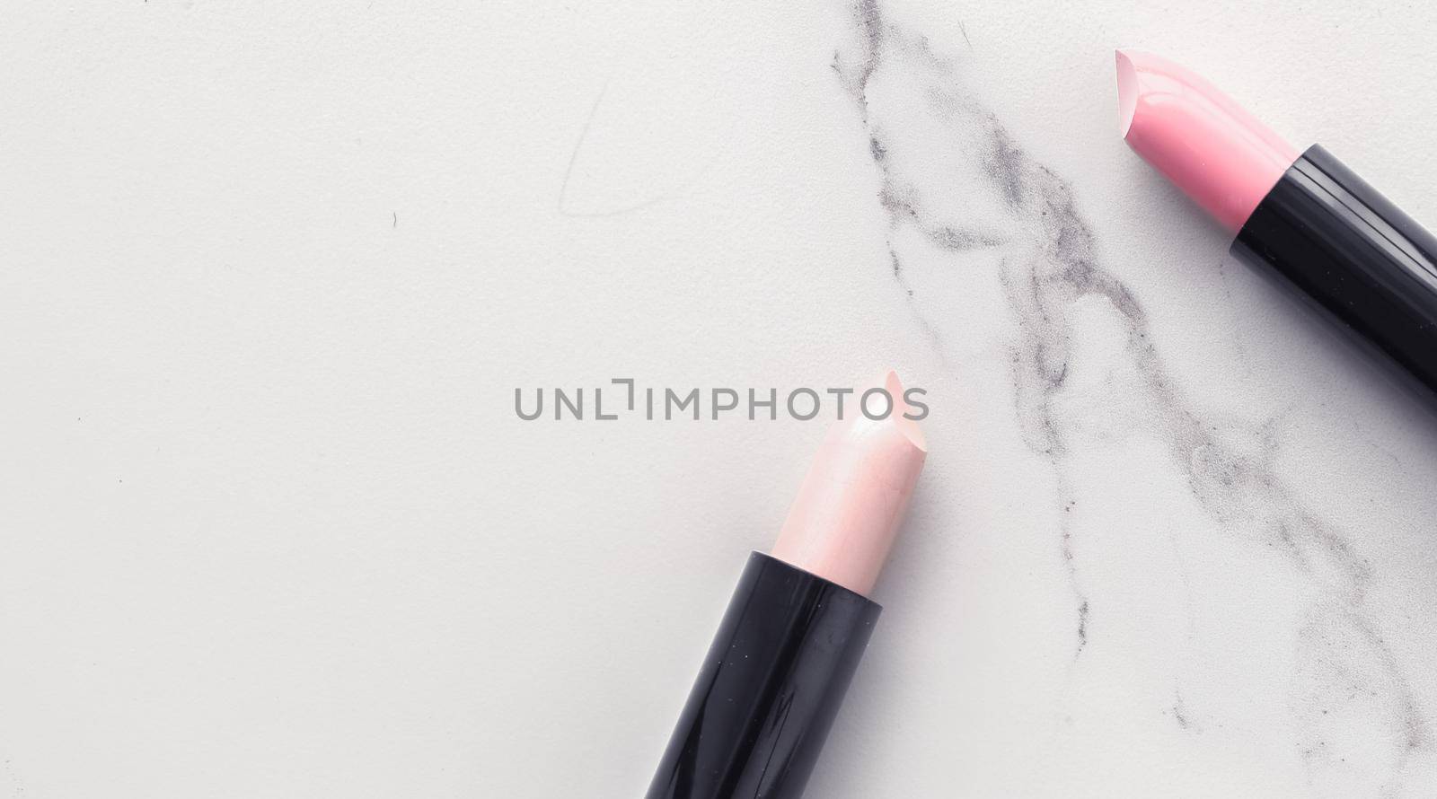 Make-up and cosmetics flatlay on marble by Anneleven