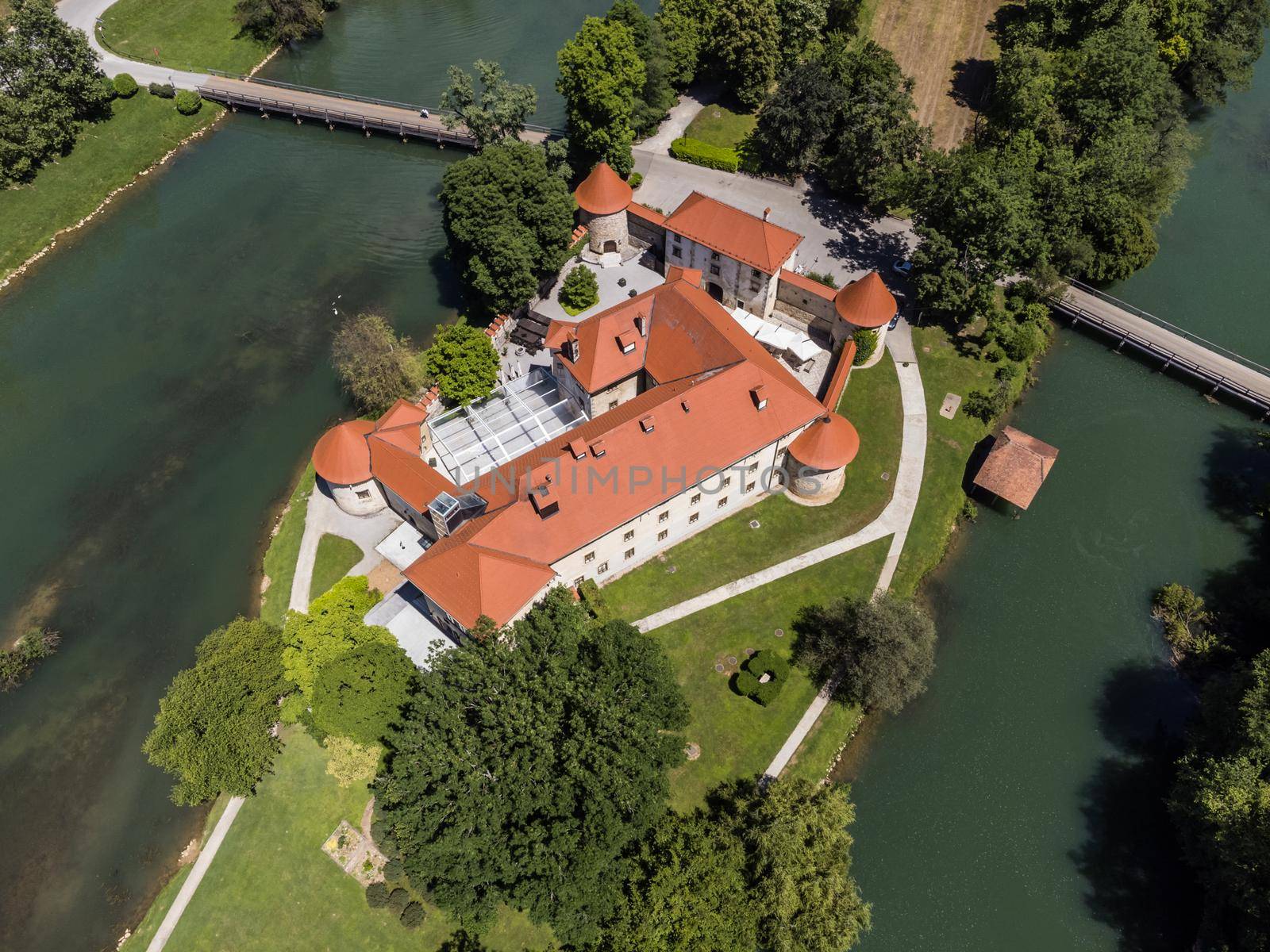 Romantic Otocec Castle on Krka River in Slovenia. Drone View