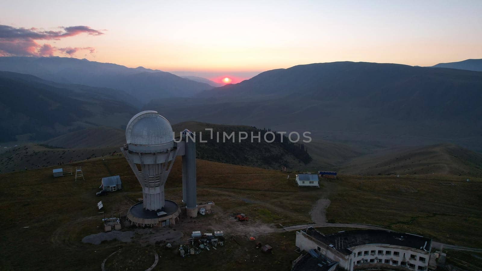 Two large telescope domes at sunset. Drone view by Passcal