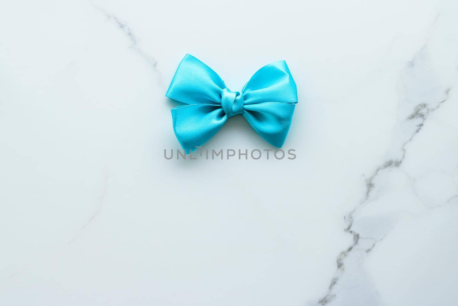 Holiday decor, feminine design and flatlay concept - Blue silk ribbon on marble, top view