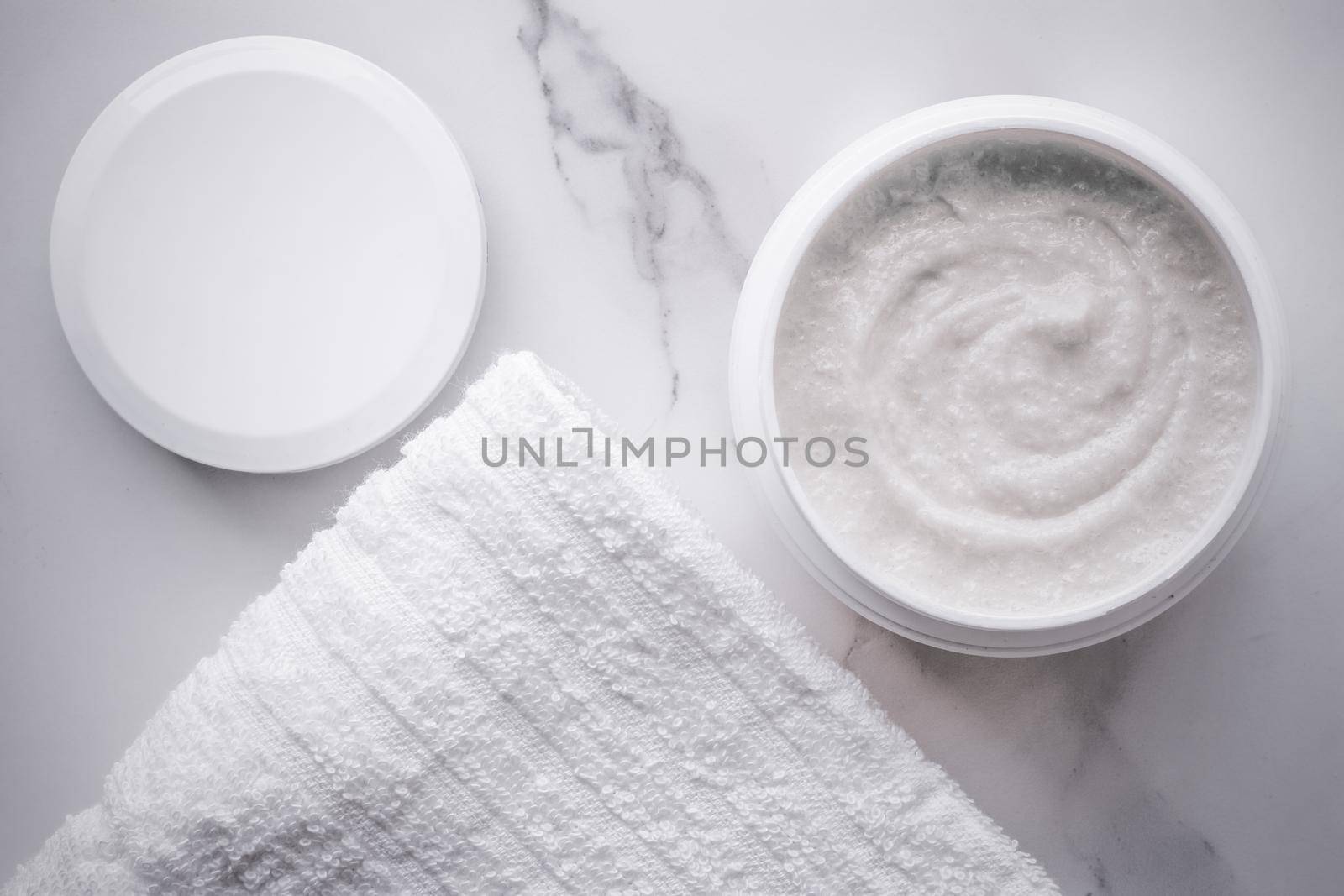 Skincare and body care, luxury spa and clean cosmetic concept. Health and beauty of your skin - Scrub and exfoliating cream products on a marble, flatlay