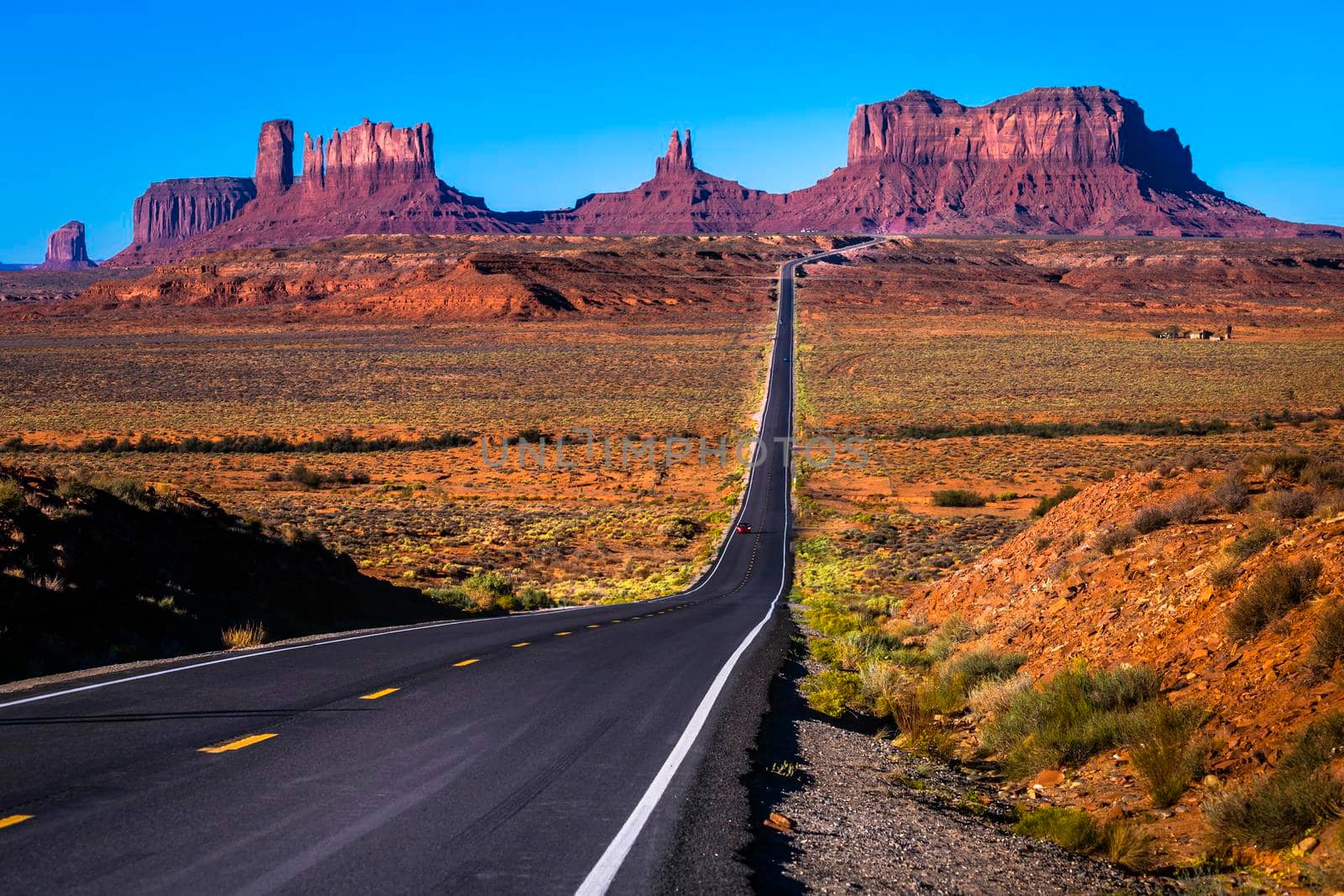 Highway Road U.S. Highway 163 and Monument Valley at sunset, Arizona, United States