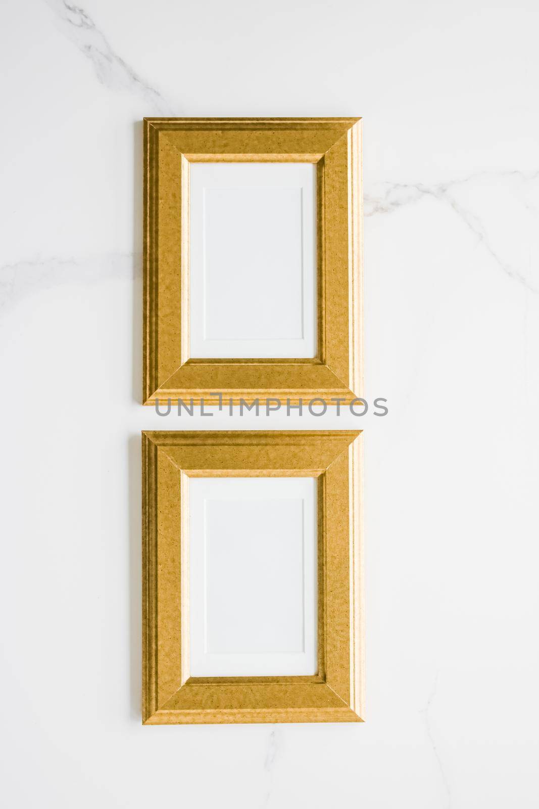 Golden photo frame on marble, flatlay - modern feminine, artwork mock up, luxury design concept. Decorate with chic and style