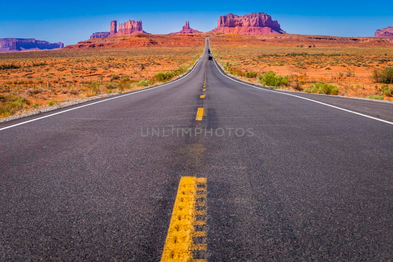 Highway Road U.S. Highway 163 and Monument Valley at sunset, Arizona, United States