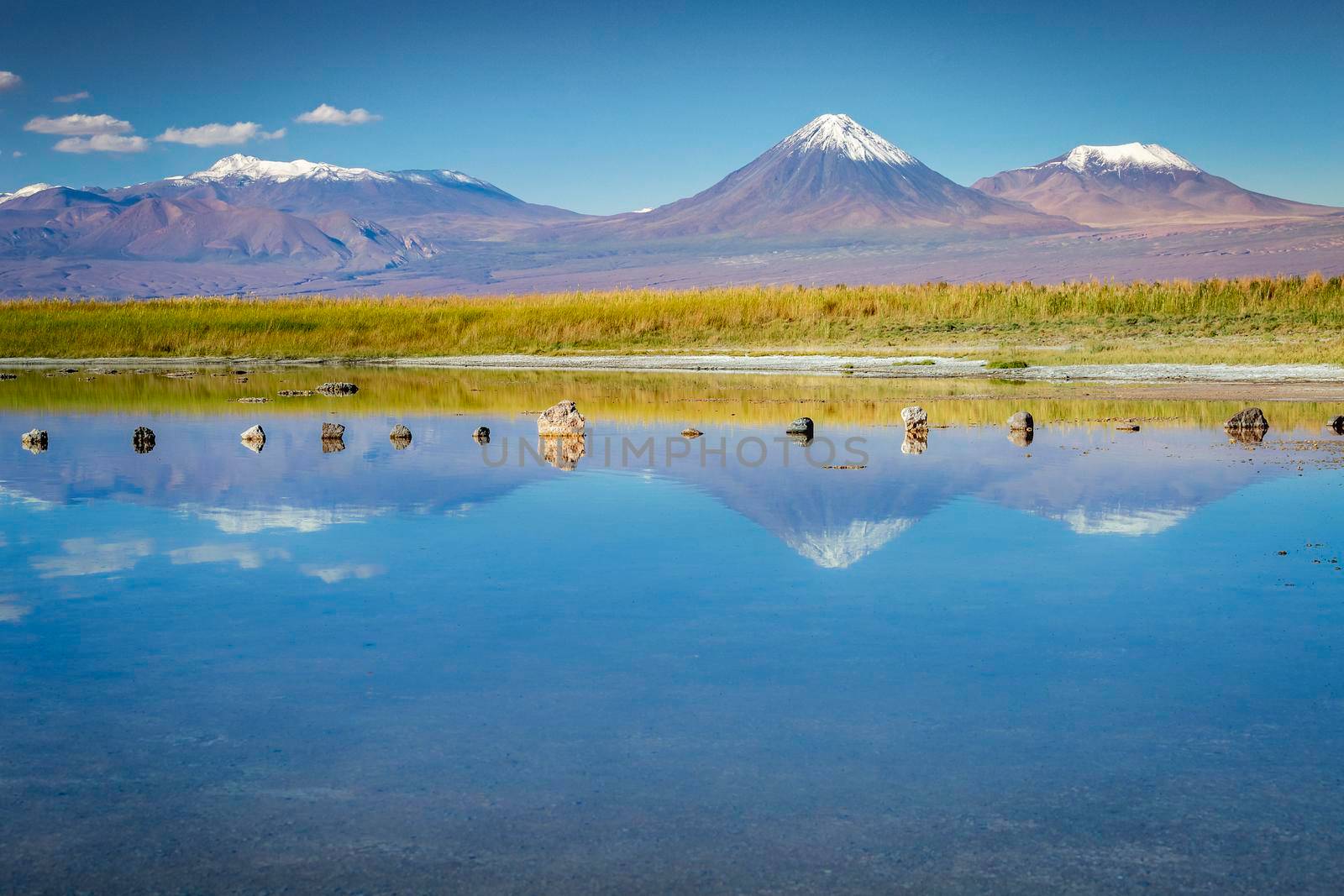 Licancabur volcanic landscape and salt lake reflection in Atacama Desert, Chile, South America