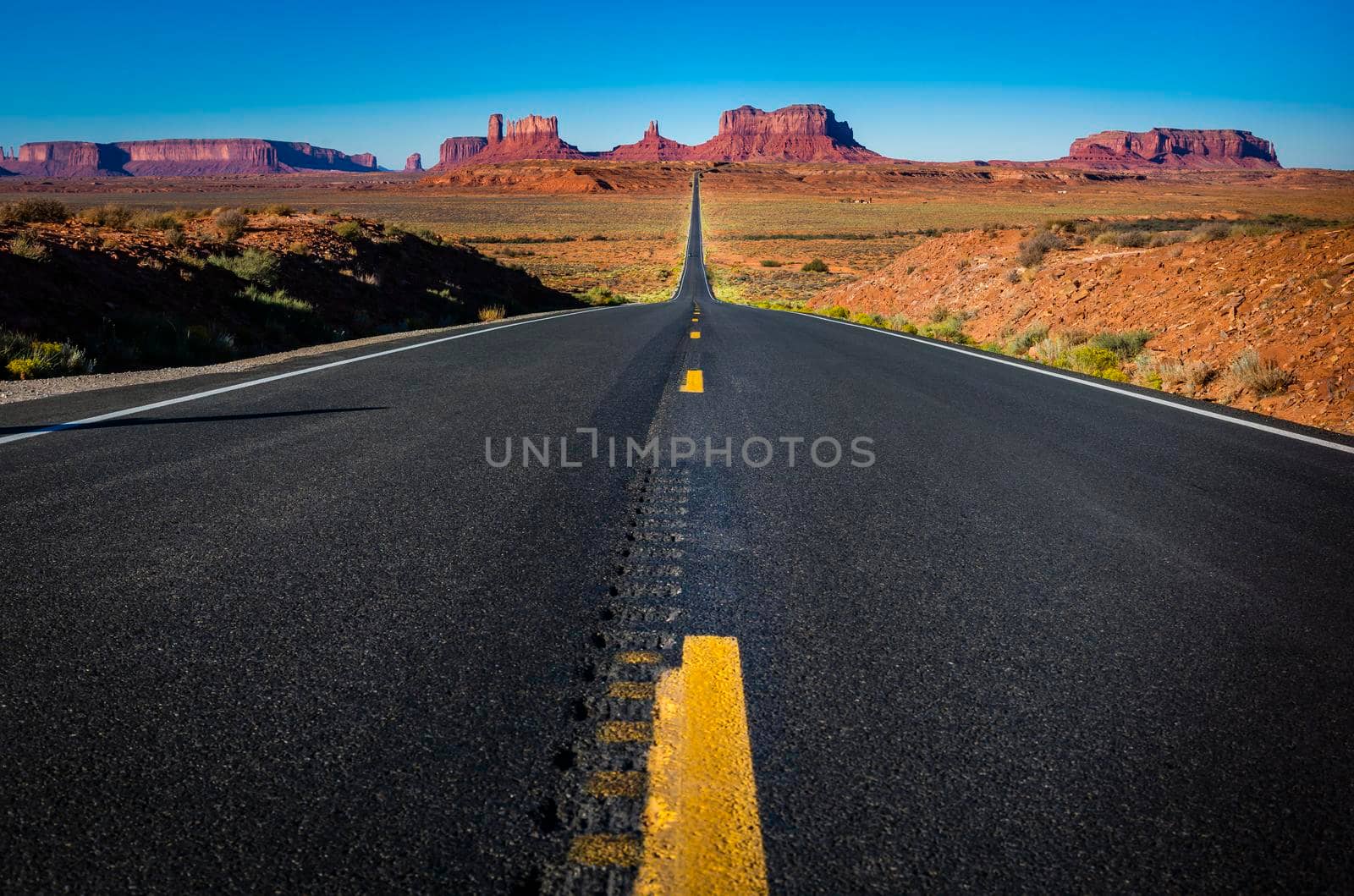 Highway Road U.S. Highway 163 and Monument Valley at sunset, Arizona, United States