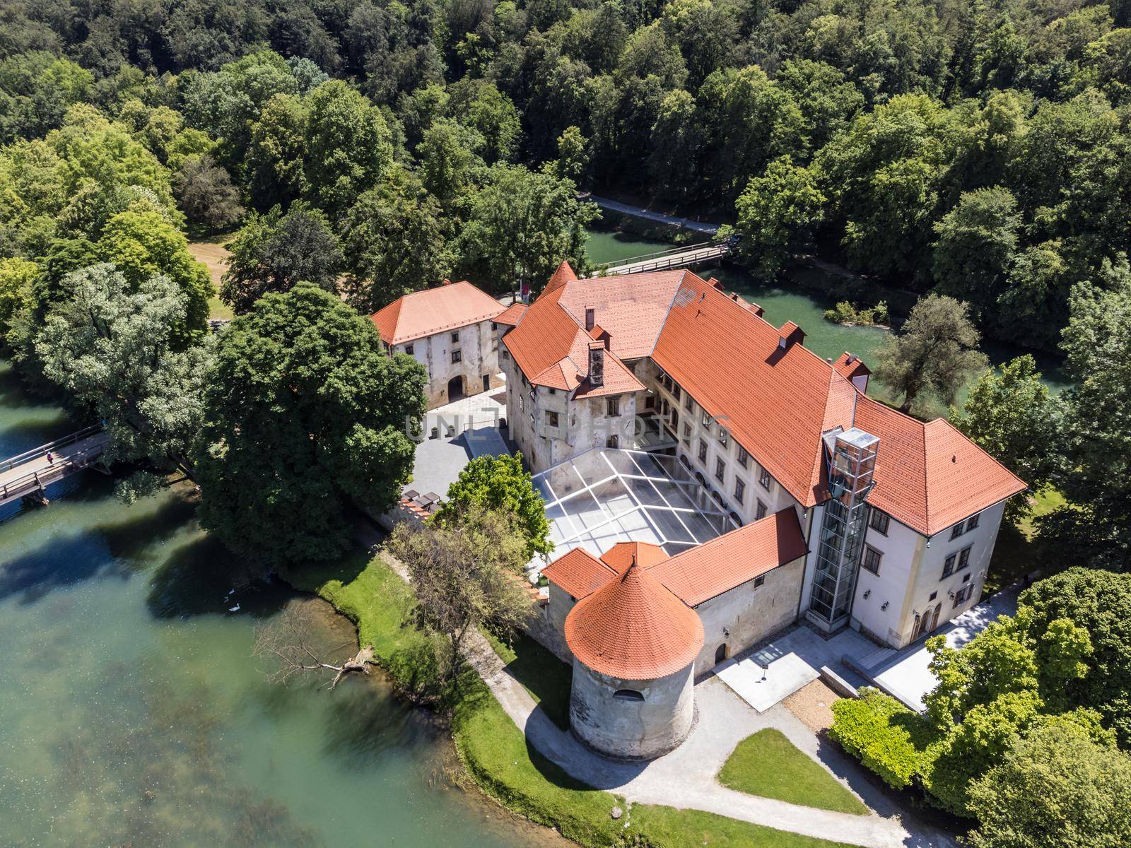 Romantic Otocec Castle on Krka River in Slovenia. Drone View. by kasto