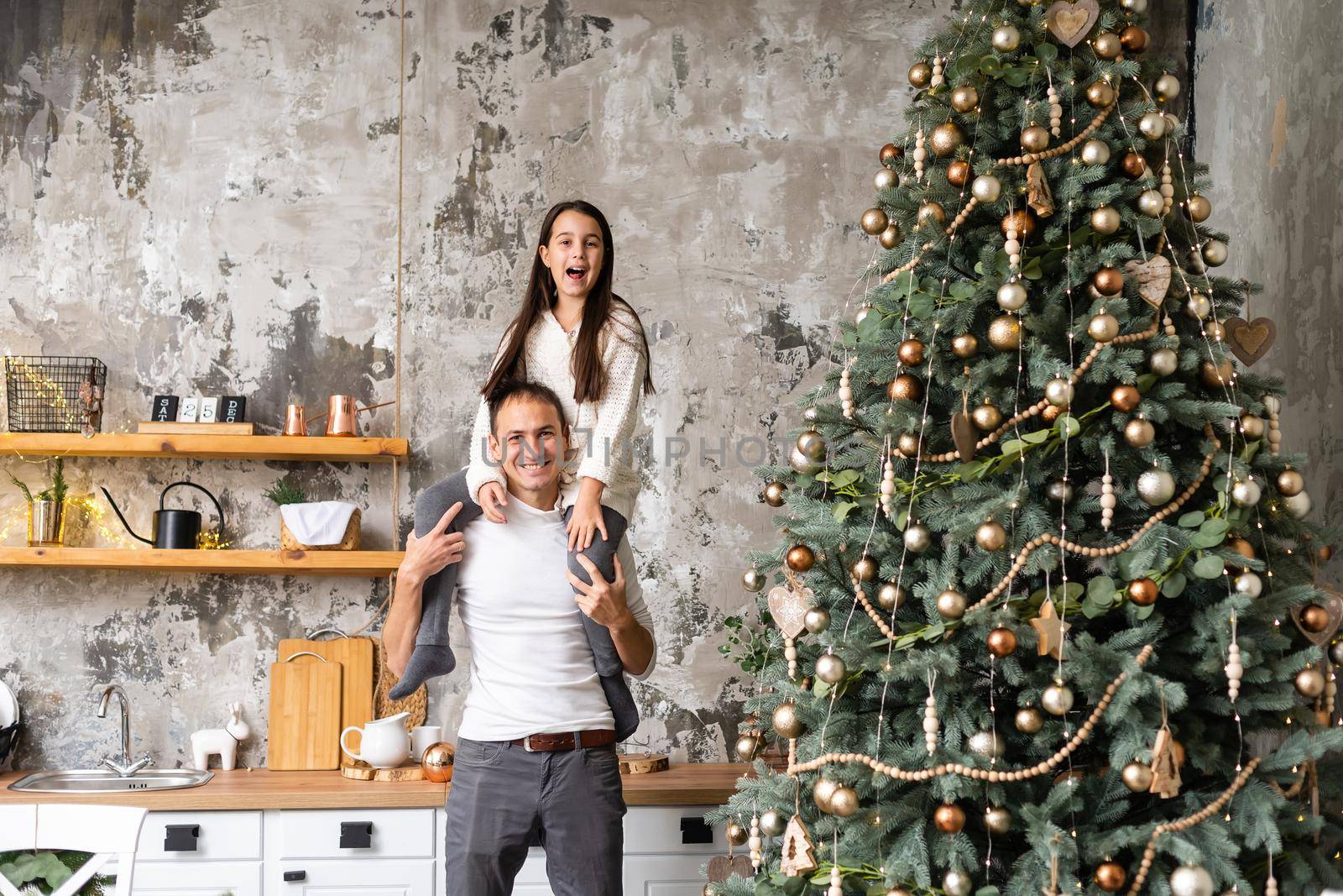 family, christmas, x-mas, winter, happiness and people concept - smiling family Preparing to celebrate Christmas