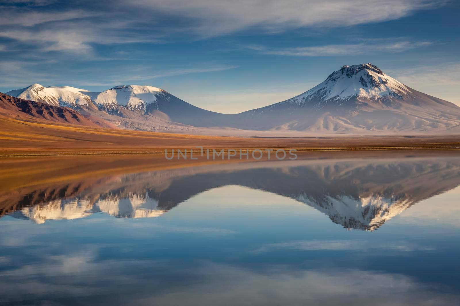 Idyllic Lake Lejia reflection and volcanic landscape in Atacama desert, Northern Chile, South America