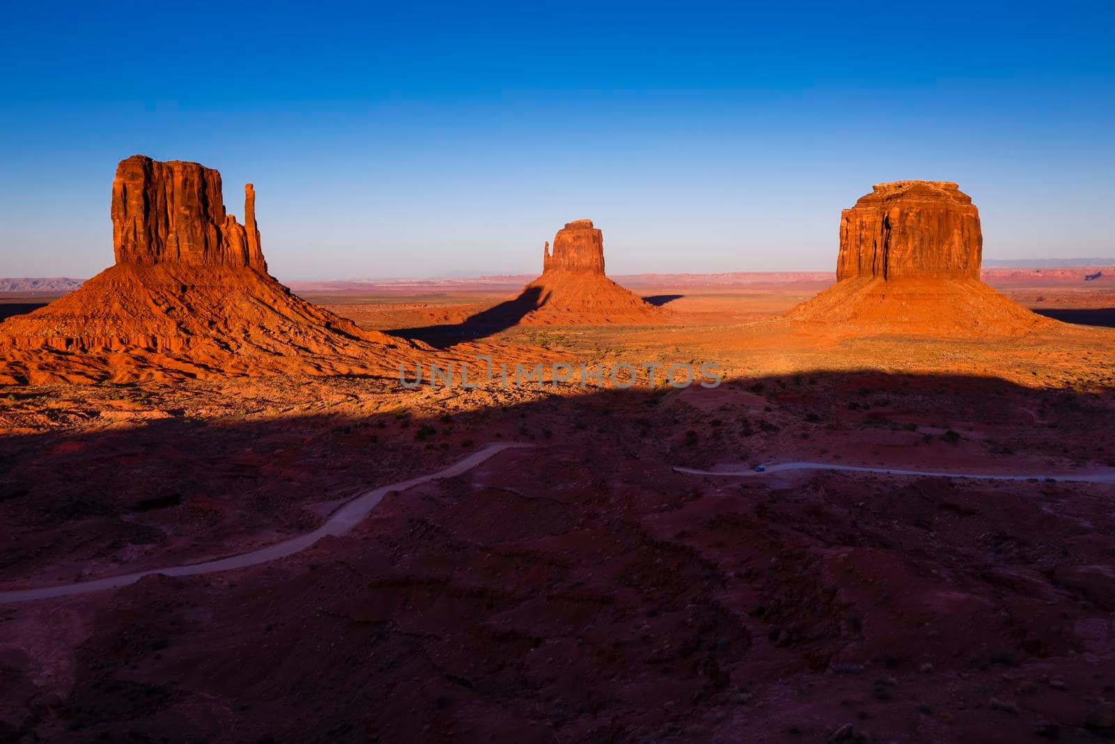 The Mittens, three buttes in Monument Valley at sunrise, Arizona and Utah, United States