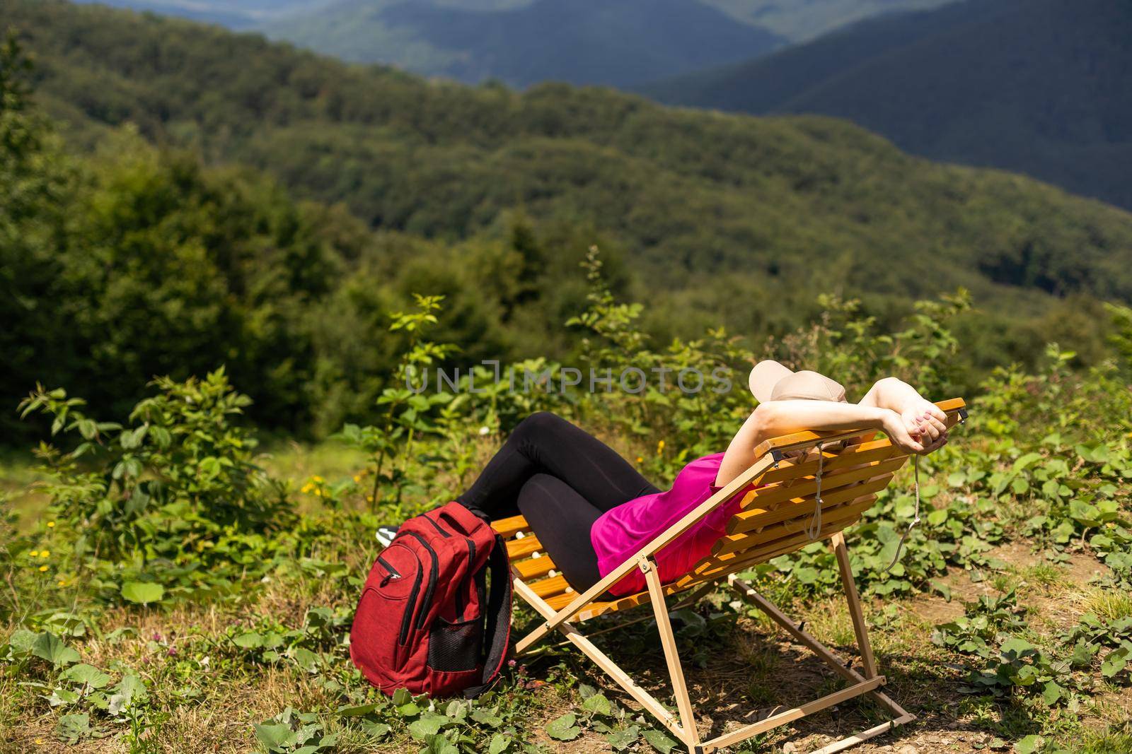 Freedom traveler woman on the top of mountains enjoy a wonderful nature. Yound girl on peak mountain with perfect view mountains. travel concept.