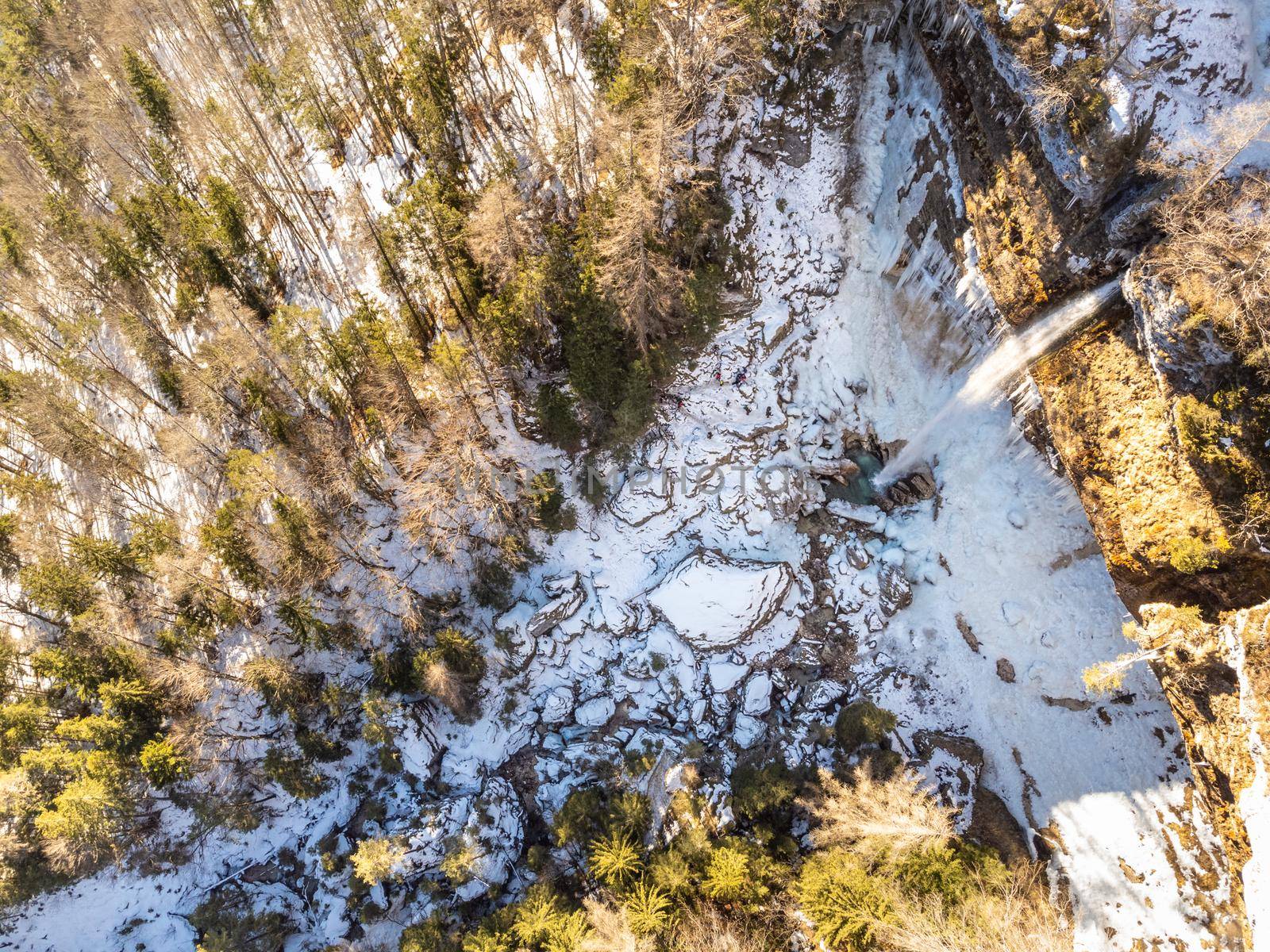 Aerial view of Pericnik slap or Pericnik Waterfall in winter time, Triglav National Park, Slovenia. Upper and lower waterfalls cascading over a rocky cliff, reachable by a picturesque walking trail