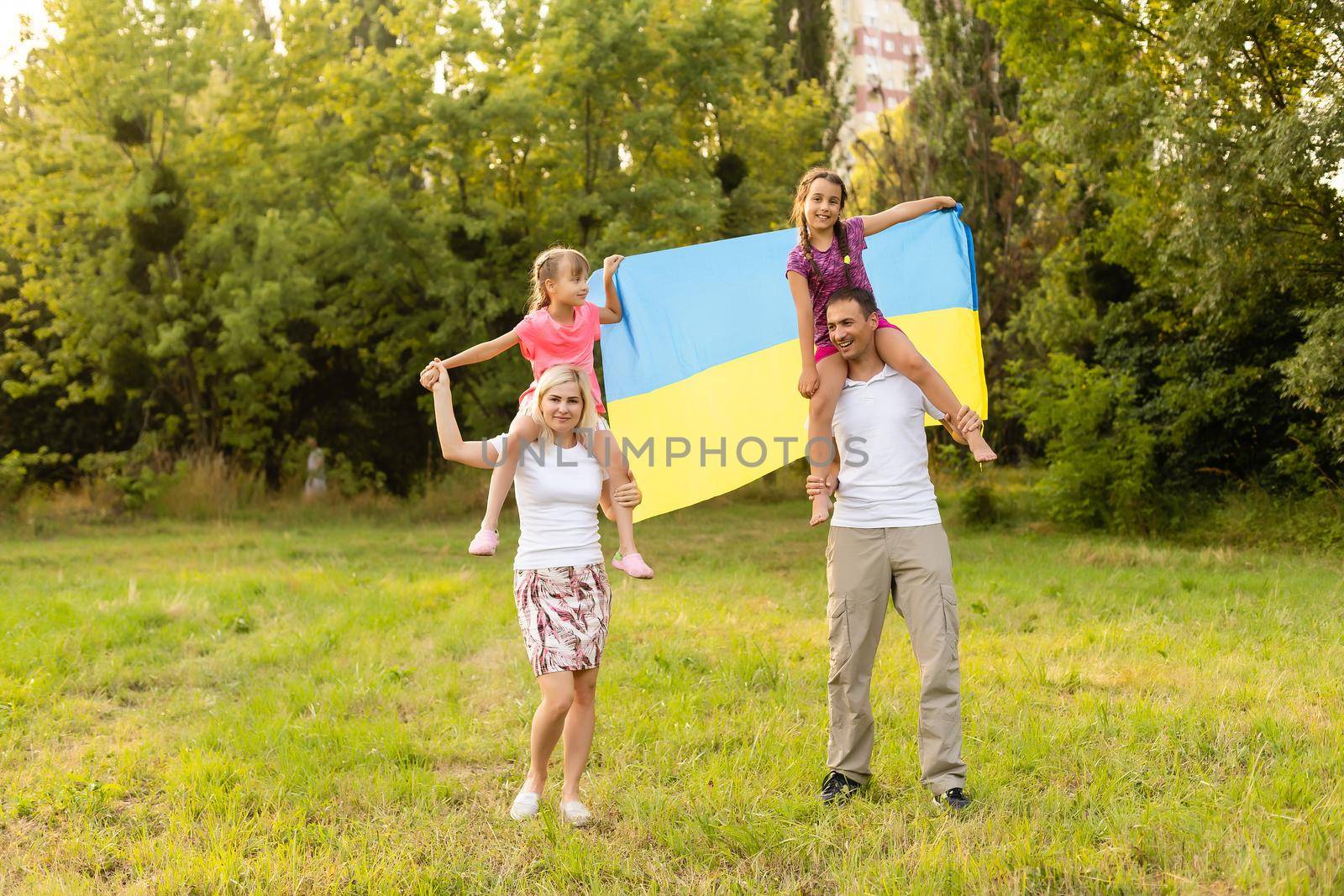 happy family with flag of ukraine in field. lifestyle.