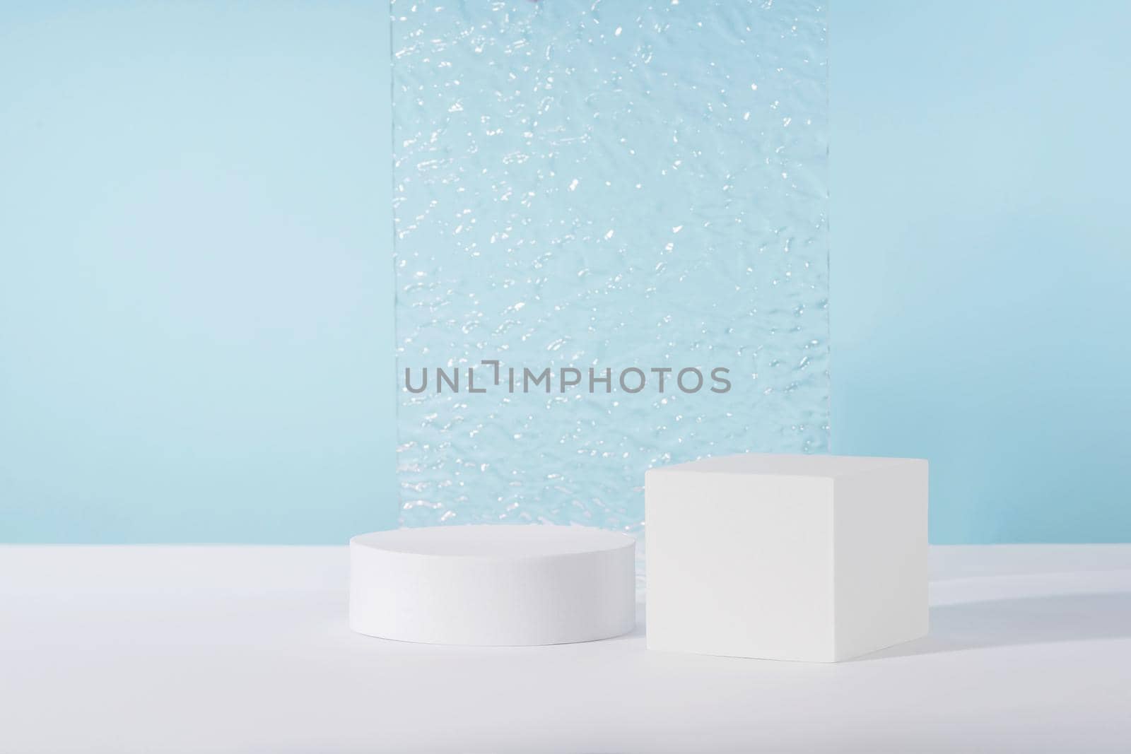 Acrylic ribbed plate, podium, background for cosmetic product packaging on blue backdrop. Showcase for jewellery presentation, display for perfume advertising, cosmetics branding scene mockup