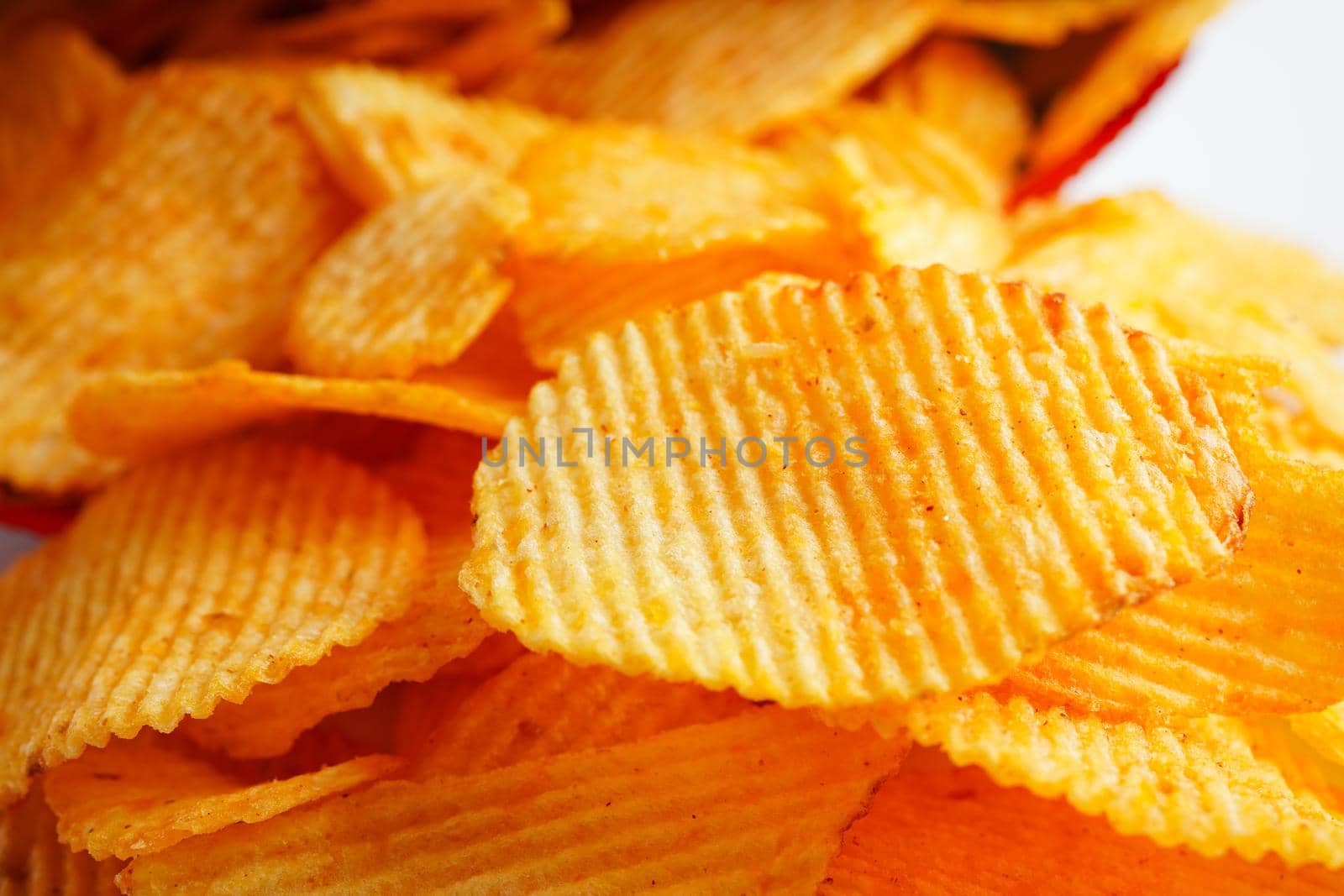 Potato chips in open bag, delicious BBQ seasoning spicy for crips, thin slice deep fried snack fast food.