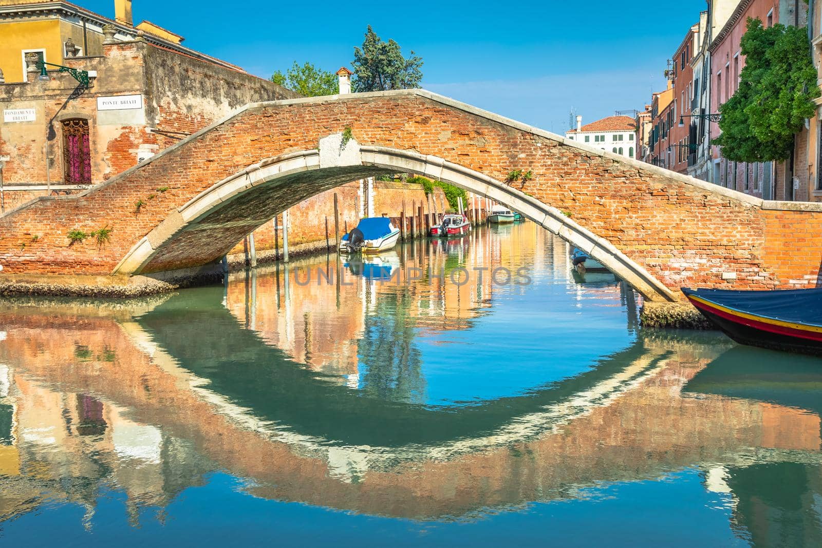 Peaceful Canal scenary in romantic Venice at springtime, Northern Italy