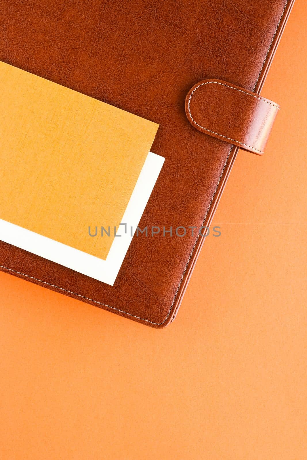 Modern workspace, productivity and corporate lifestyle concept - Luxury business brown brief-case on the office table desk, flatlay