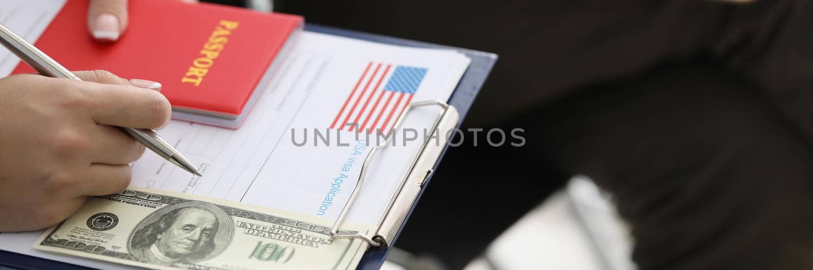 People sitting in line with documents for obtaining American visa and money closeup. Travel to usa assistance with paperwork concept