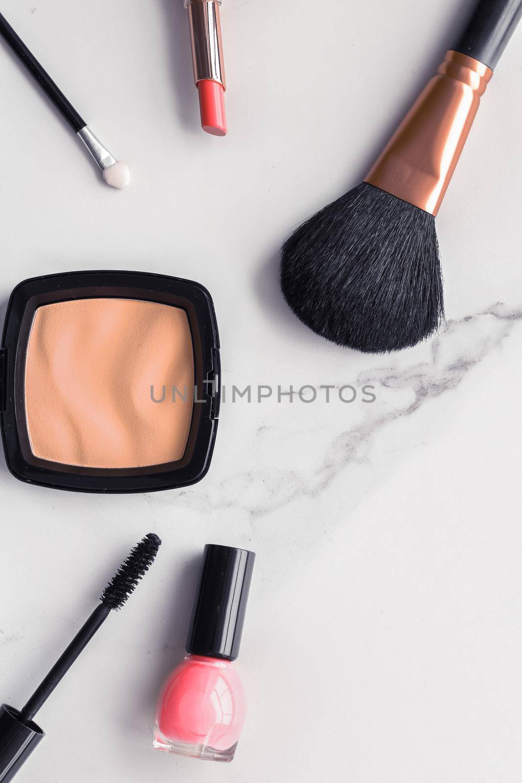 Make-up and cosmetics flatlay on marble by Anneleven