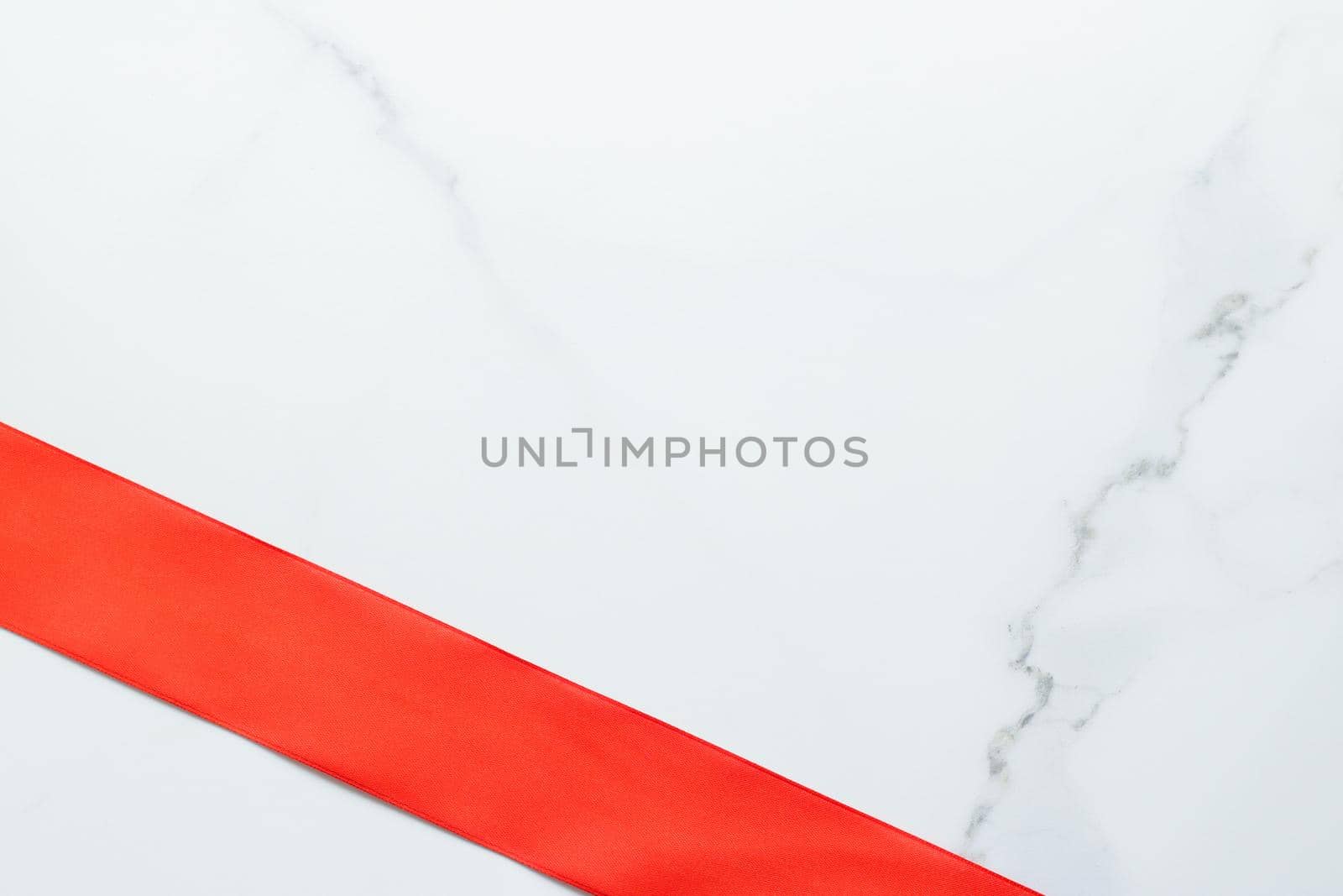 Holiday decor, feminine design and flatlay concept - Red silk ribbon on marble, top view