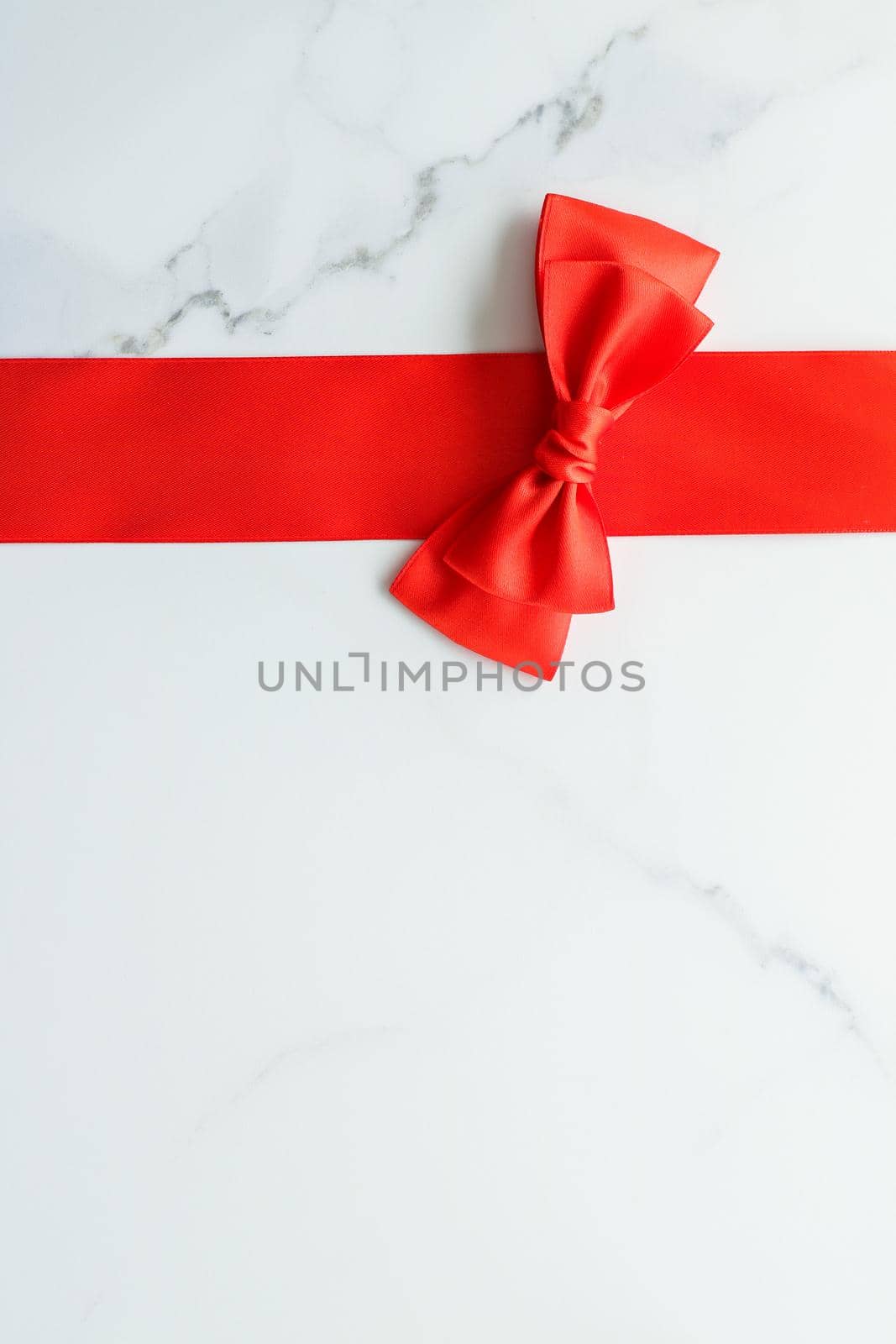 Holiday decor, feminine design and flatlay concept - Red silk ribbon on marble, top view