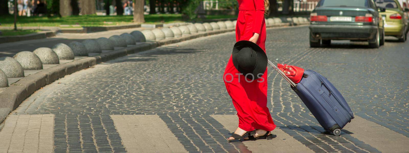 Woman crosses road through crosswalk by okskukuruza