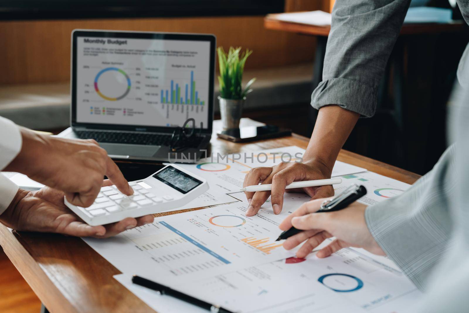 business adviser meeting to analyze and discuss the situation on the financial report. Financial advisor and accounting concept. High quality photo.