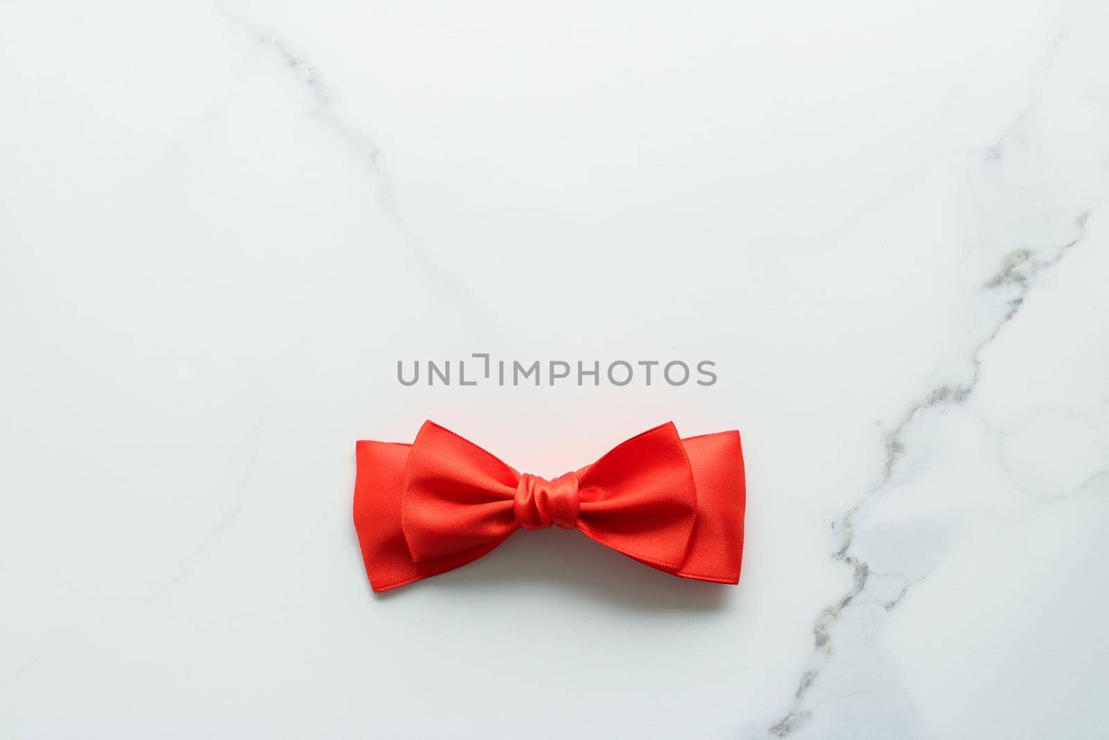 Holiday decor, feminine design and flatlay concept - Red silk ribbon on marble, top view