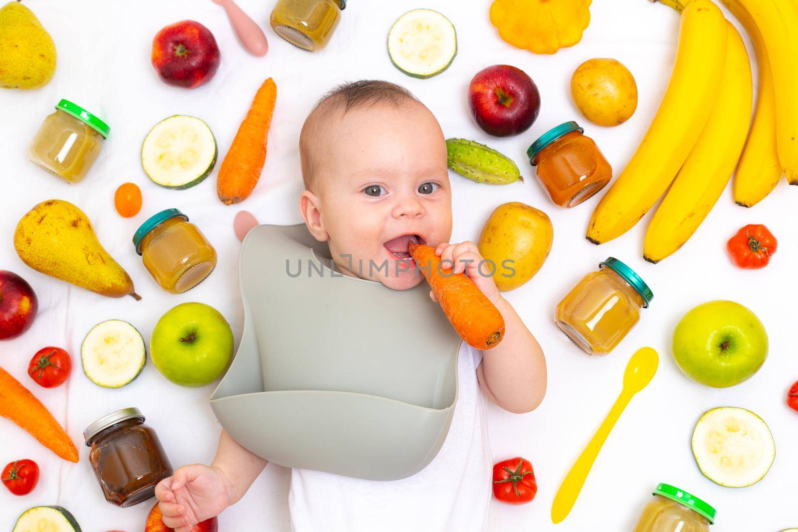 Puree for baby food with vegetables and fruits. Selective focus. nutrition. The first complementary feeding of the child. A happy child. A well- fed child