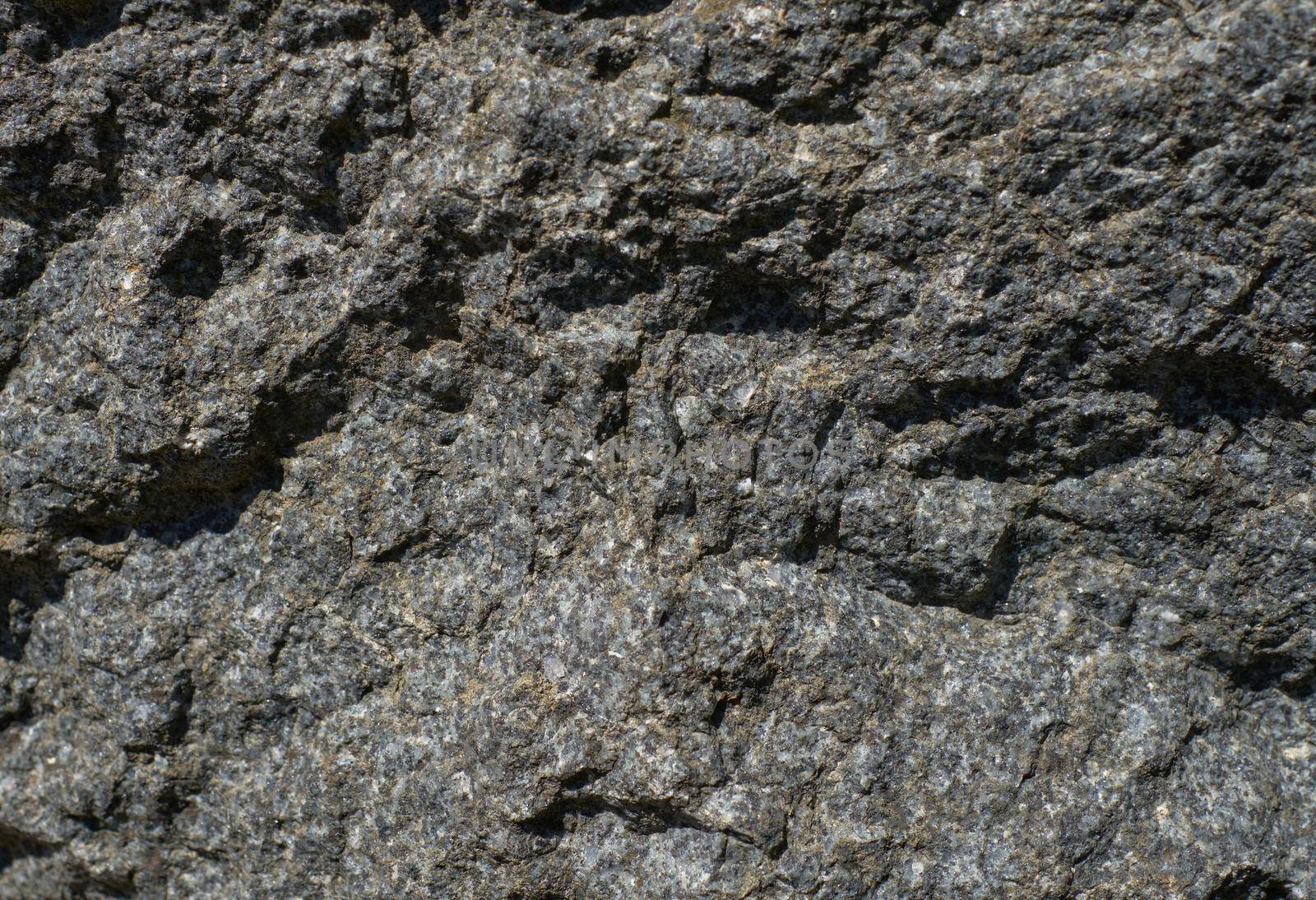 Old chipped natural stone close-up
