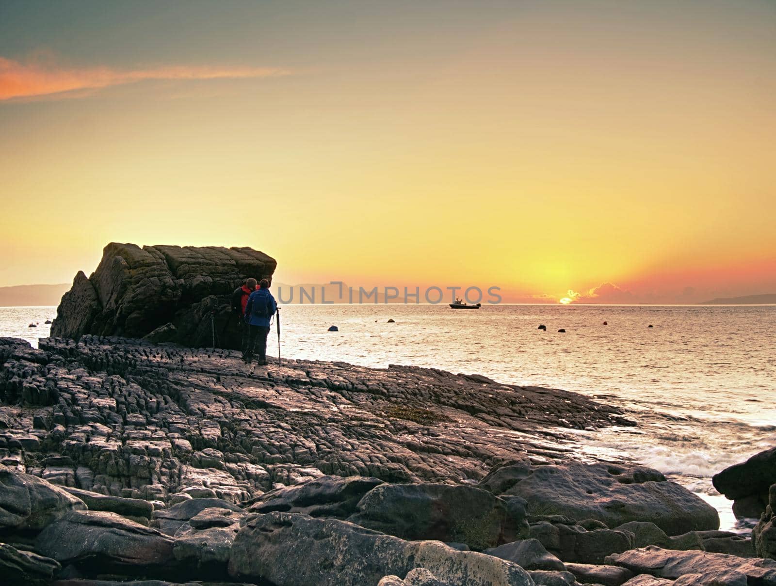 7th of February 2017, Isle of Skye, Scotland. Group of photographers in Elgol. Popular sunset photography above sea level