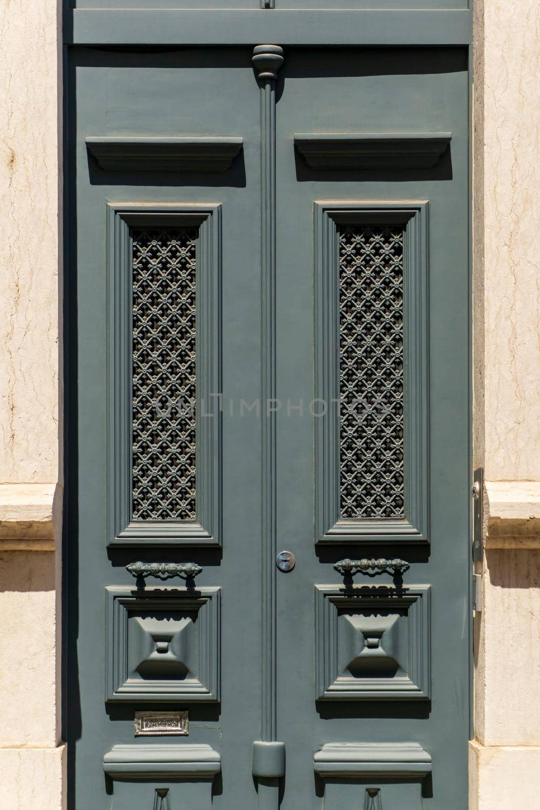 Beautiful gray vintage closed door to the building background