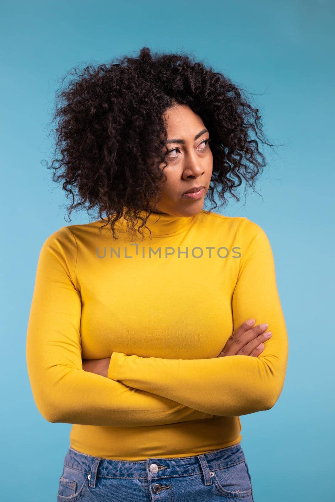 Young mixed race woman is very glad. Concept of surprise, great news, sales, profitable offer. Excited happy lady on purple studio background. High quality photo