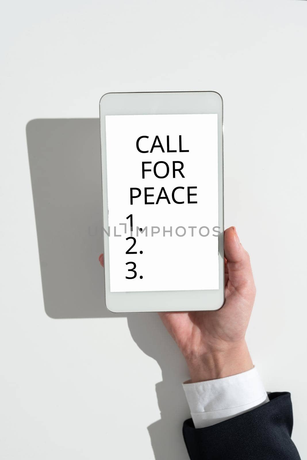 Hand writing sign Call For Peace. Conceptual photo Make votes to a peaceful world Be calmed relaxed do not fight Lady in suit holding pen symbolizing successful teamwork accomplishments. by nialowwa