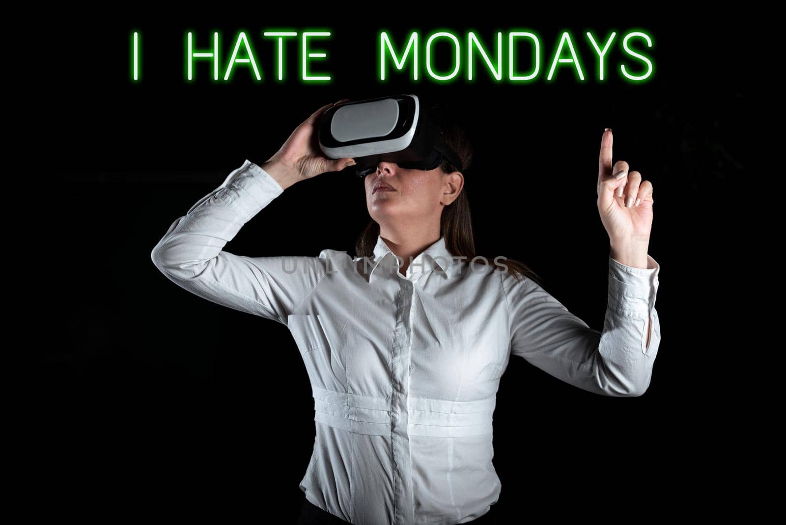 Text sign showing I Hate Mondays, Business overview Not liking the first day of week Back to routine and job Businessman Pointing On A Pattern With Digital Symbols And Information.