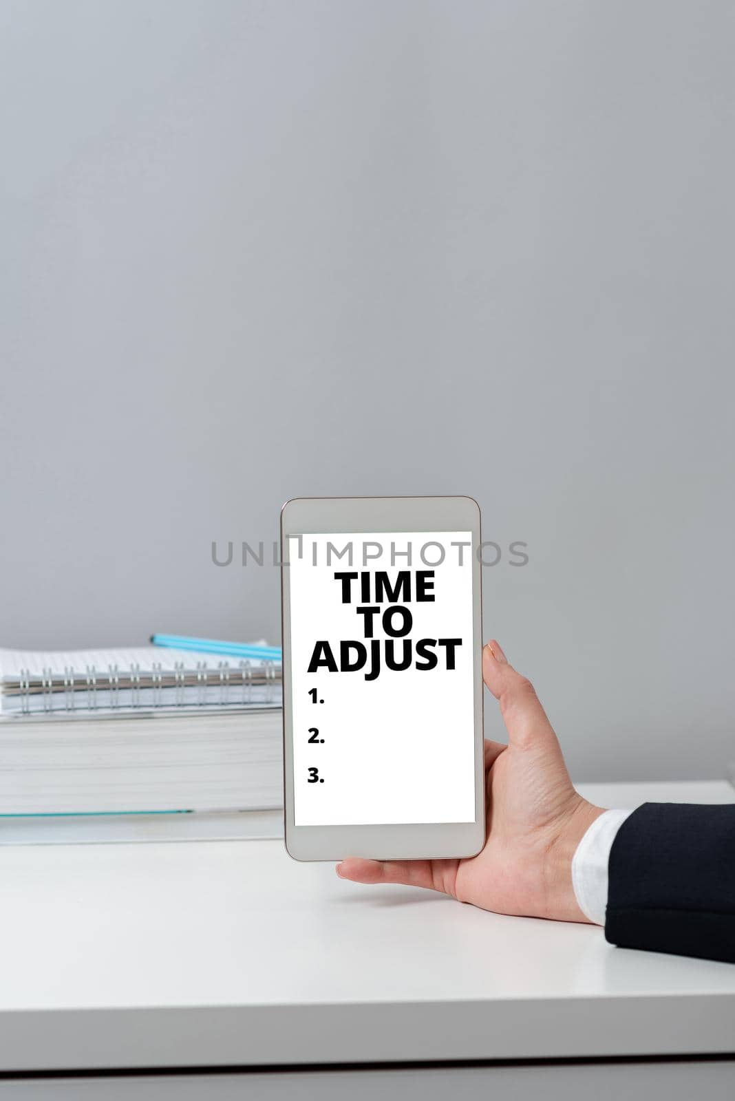 Text sign showing Time To Adjust. Business showcase Right moment for making adjustments to keep going forward Businesswoman Pointing Important Infortmations With One Finger. by nialowwa