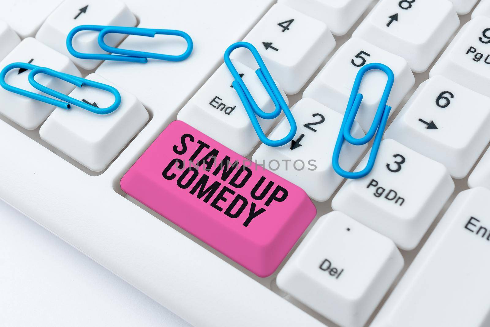 Conceptual caption Stand Up Comedy. Word for Comedian performing speaking in front of live audience Paper With Speech Bubble And Stationery Over Wood Presenting New Ideas. by nialowwa